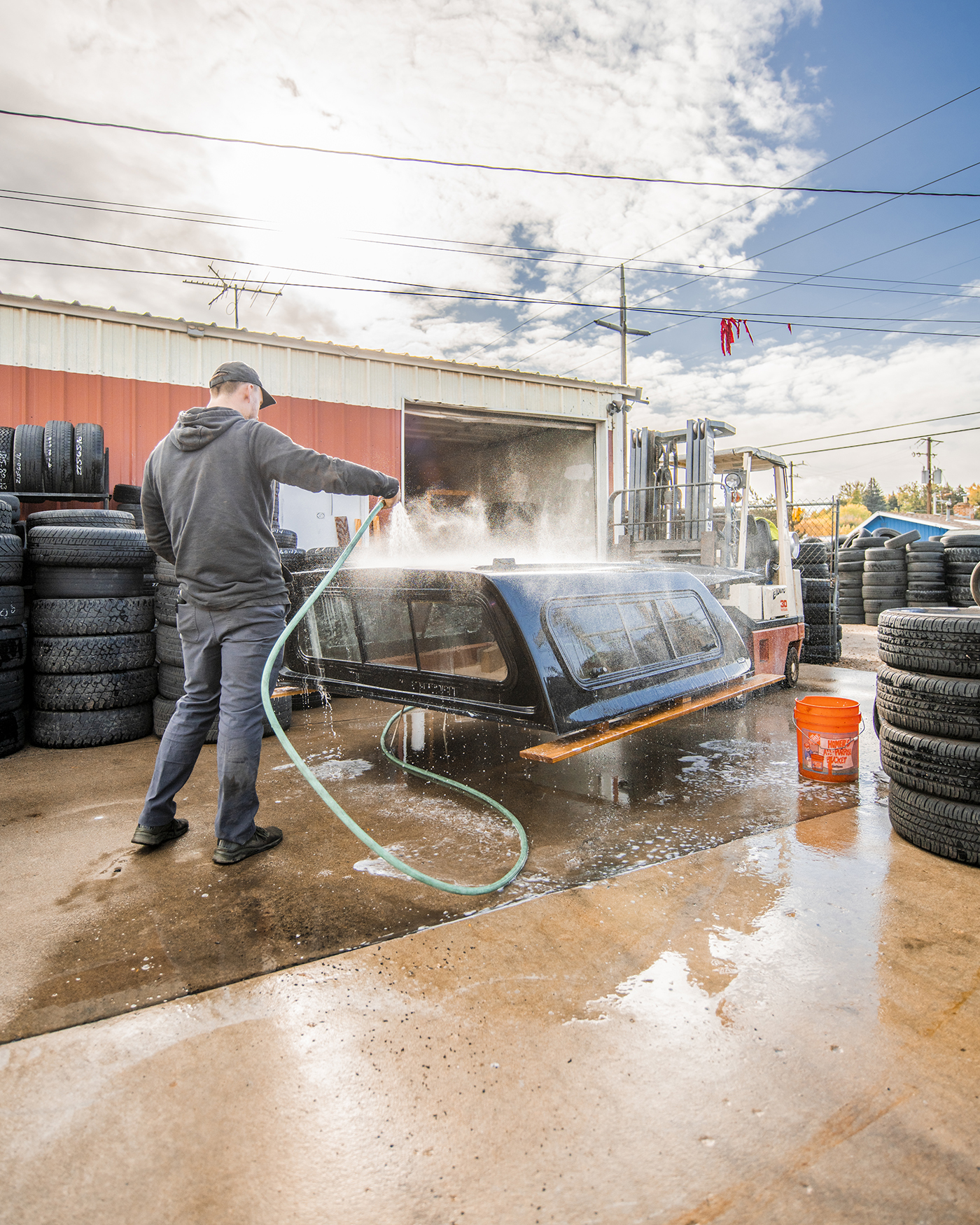 Dealer prepping a SnugTop for installation on Defconbrix Ram 2500