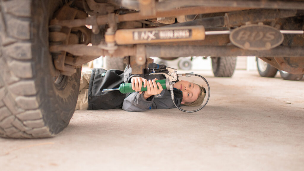 Greese suspension fittings as part of spring truck maintenance