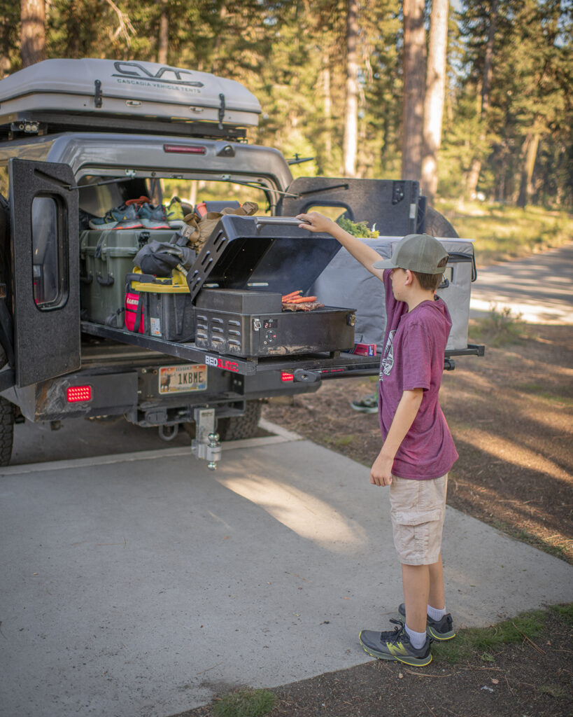 Olin Day cooking with Traeger smoker on a BEDSLIDE in Idaho
